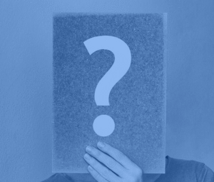 Person holding a question mark sign, representing FAQs about chiropractic care and services at Active Life Chiropractic.